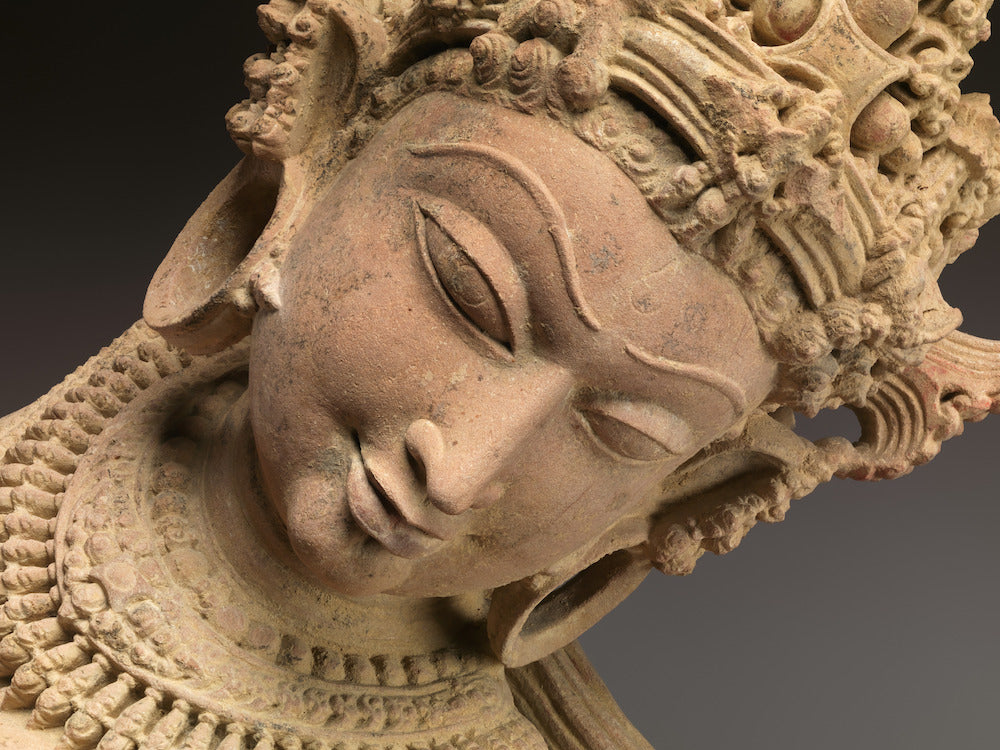 Close-up of a celestial dancer (devata), stone medieval sculpture