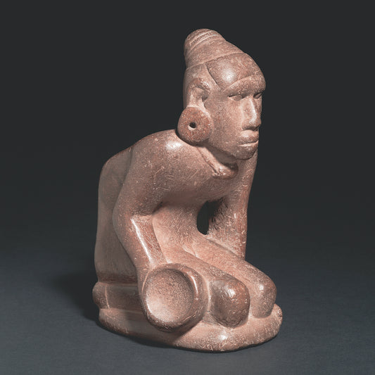 Stone sculpture of the Mississippian period depicting a chunkey player