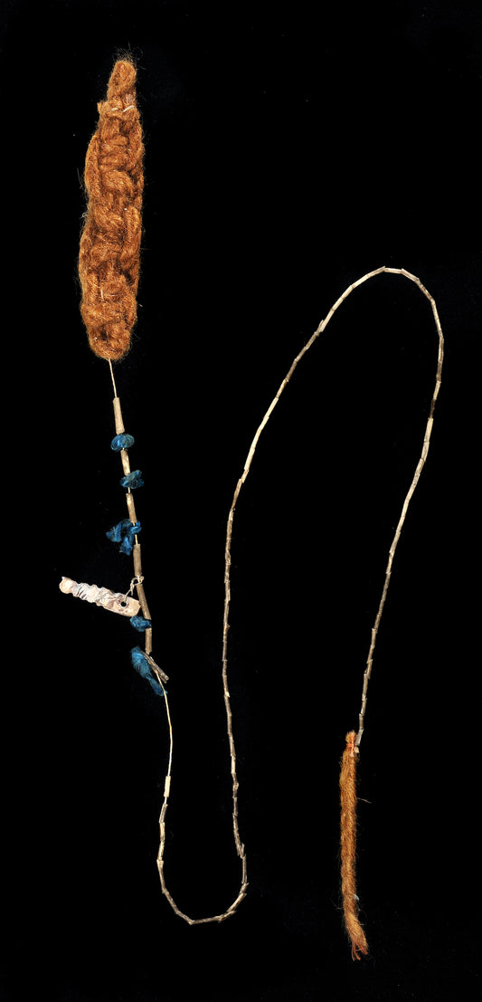 Kamak coin composed of a long string with braids of bat hair, shells, and pendants