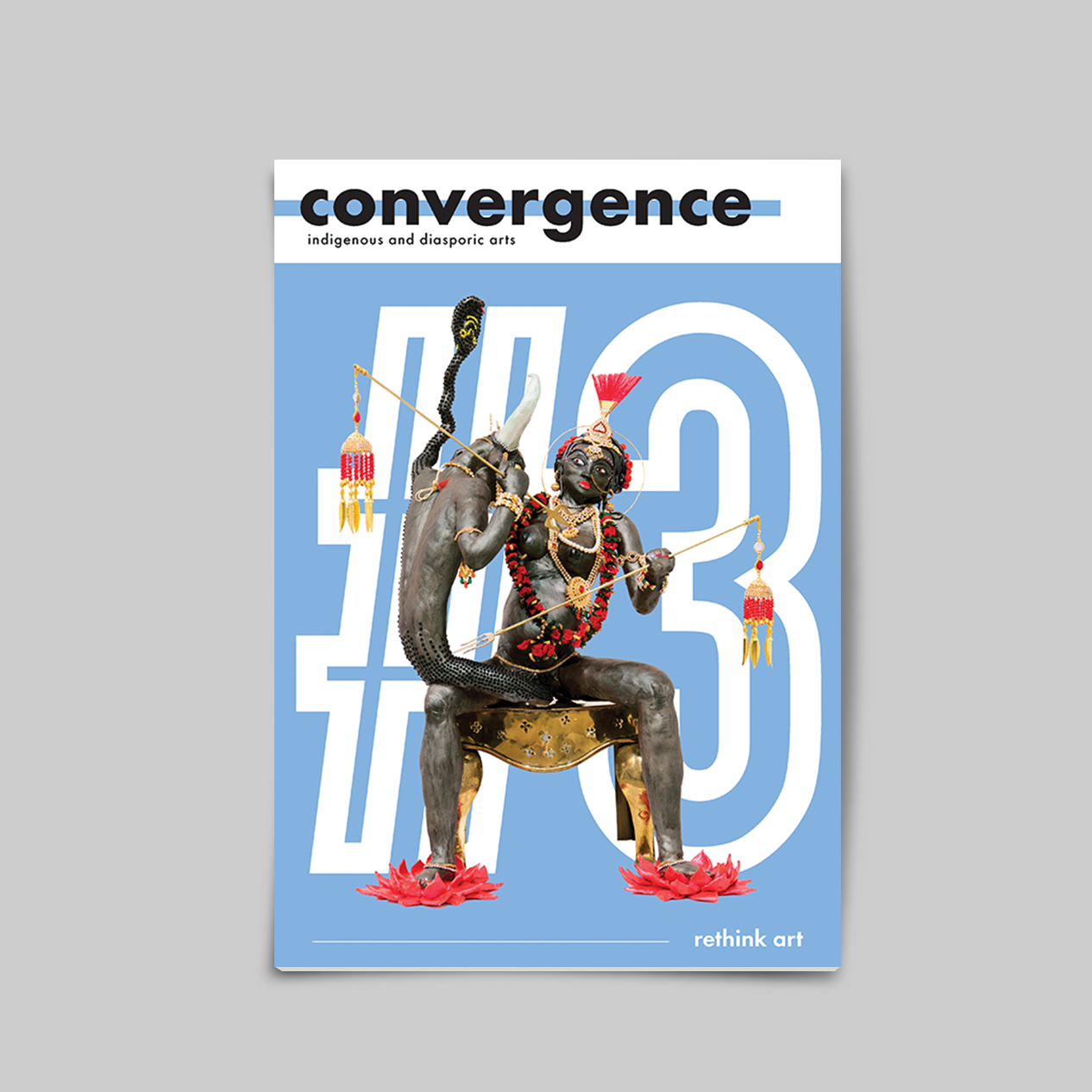 Mockup of the third issue of Convergence Magazine in English. "Endgame" by Jaishri Abichandani, a sculpture of a woman fighting a buffalo demon, is on the blue cover.